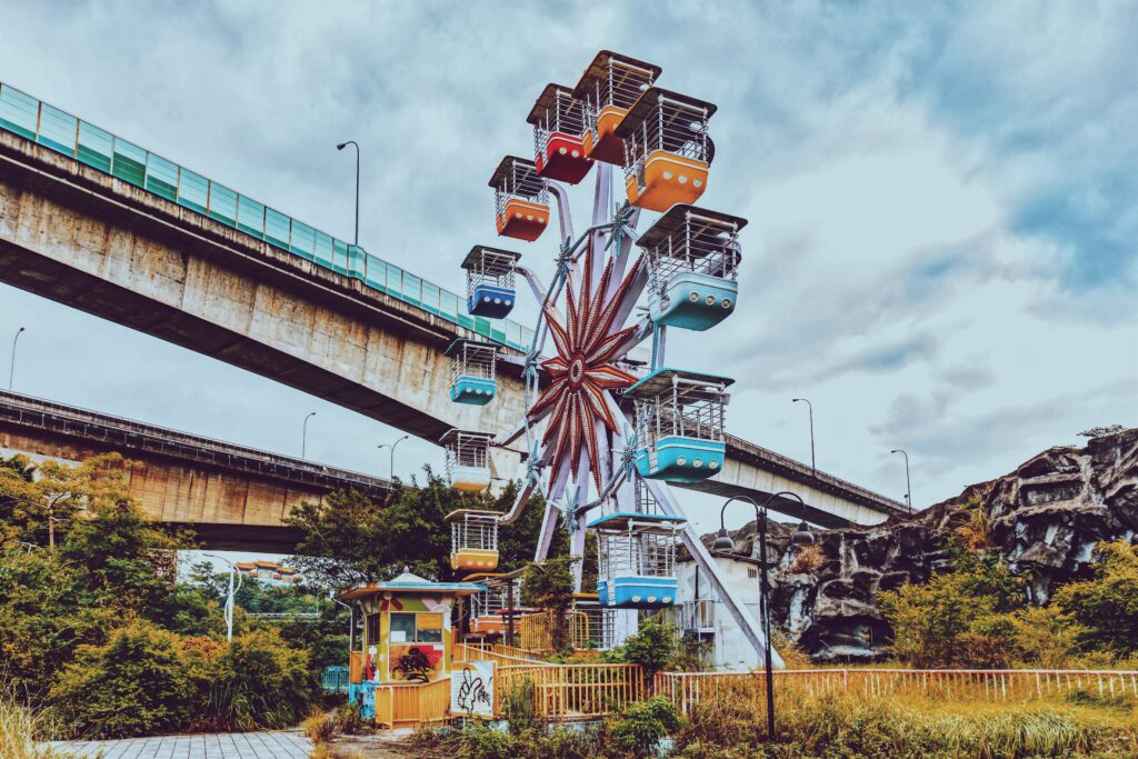 Vibrant Ferris Wheel Wallpaper: Lush Greenery & Scenic Bridge