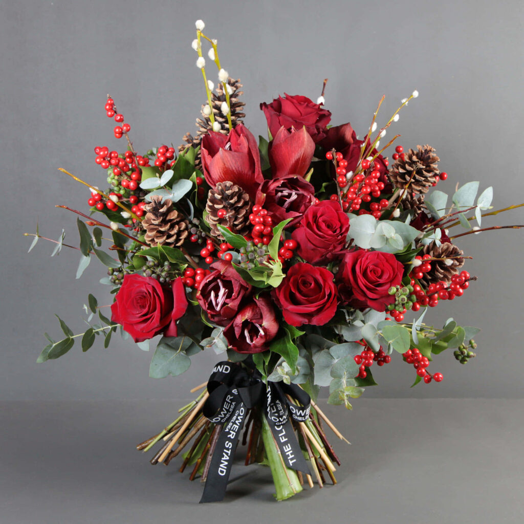 Vibrant Bouquet Wallpaper: Red Roses, Pinecones & Lush Greenery