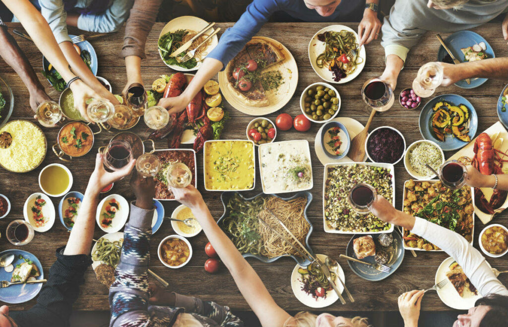 Festive Dinner Table Wallpaper: Colorful Celebration with Diverse Dishes
