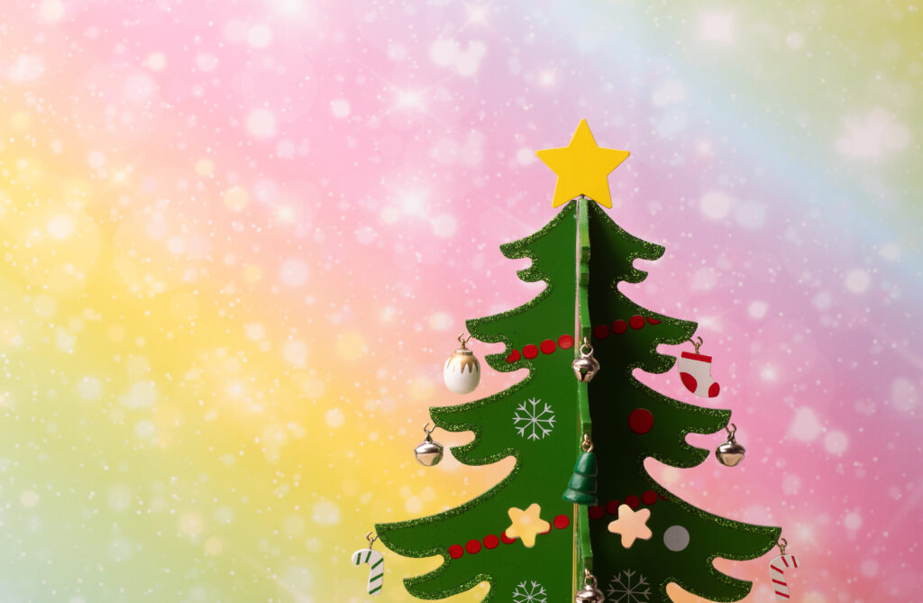 Whimsical Pastel Christmas Tree Wallpaper with Colorful Ornaments