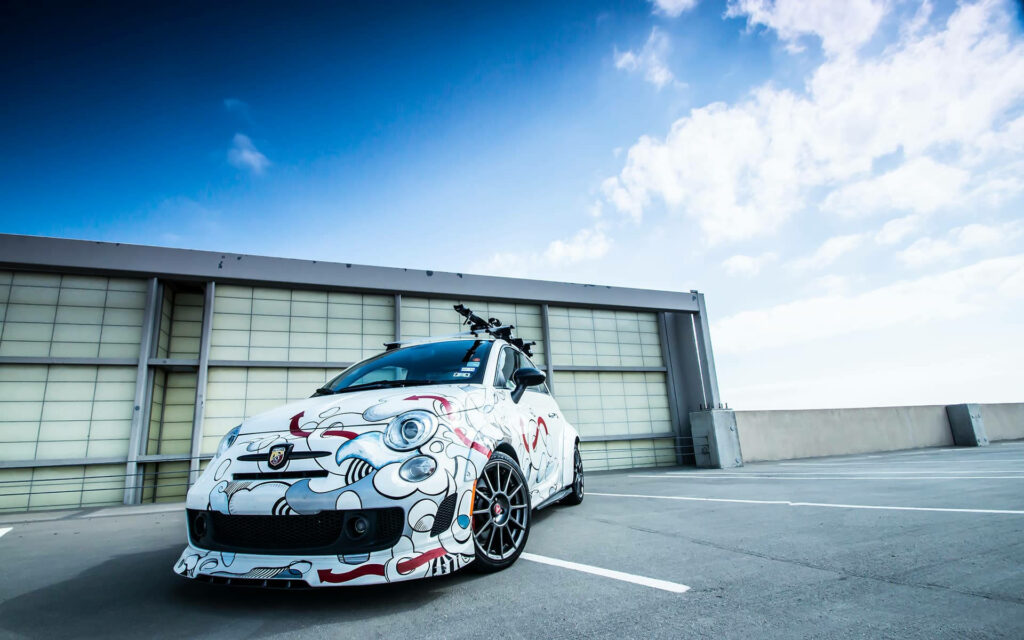 Fiat 500 Abarth 595 Custom Art Wallpaper on Urban Rooftop