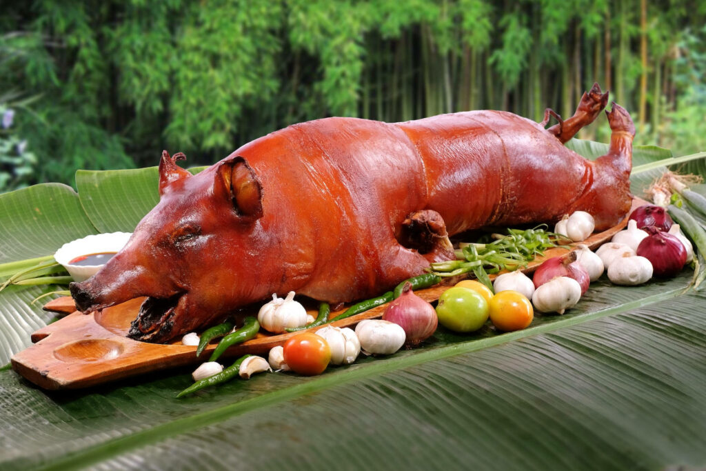 Vibrant Lechon Boodle Fight Wallpaper: Roasted Pig & Fresh Veggies