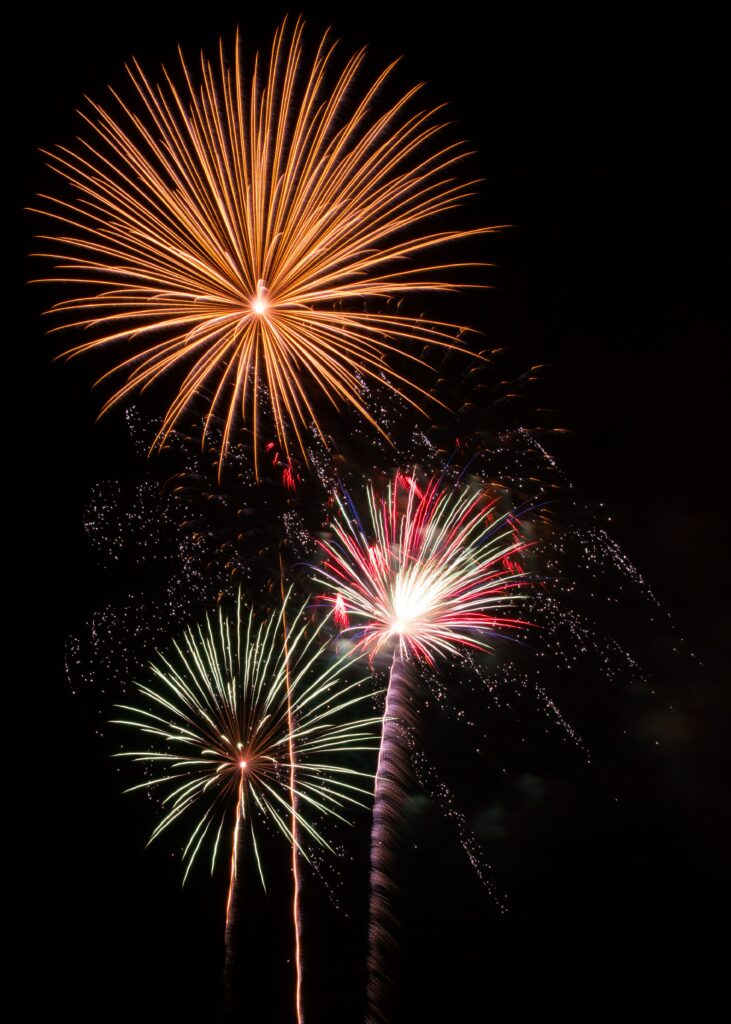 Vibrant Fireworks Wallpaper: Colorful Explosions in Night Sky