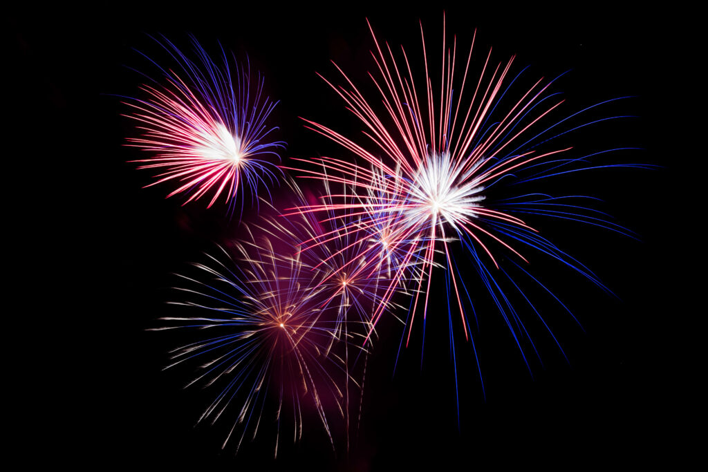 Vibrant Fireworks Wallpaper Background for Festive Holiday Vibes