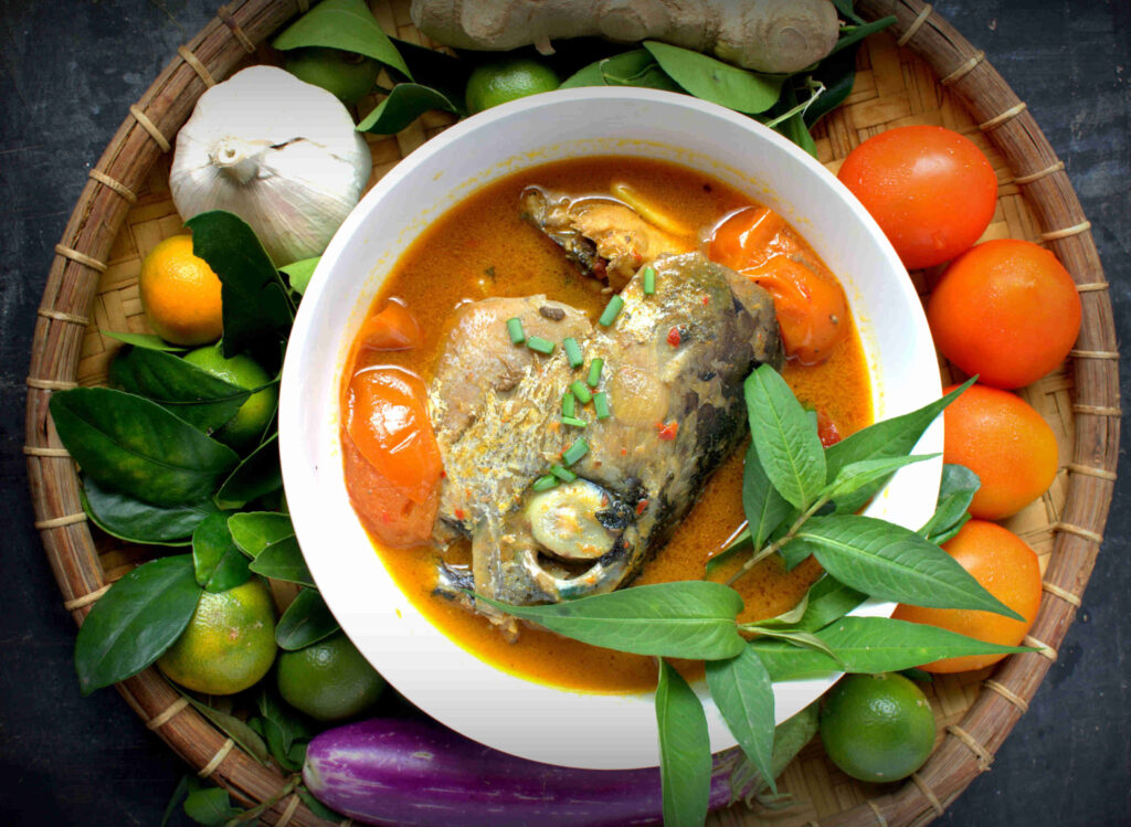Colorful Fish Head Curry Flat Lay with Fresh Ingredients - Wallpaper