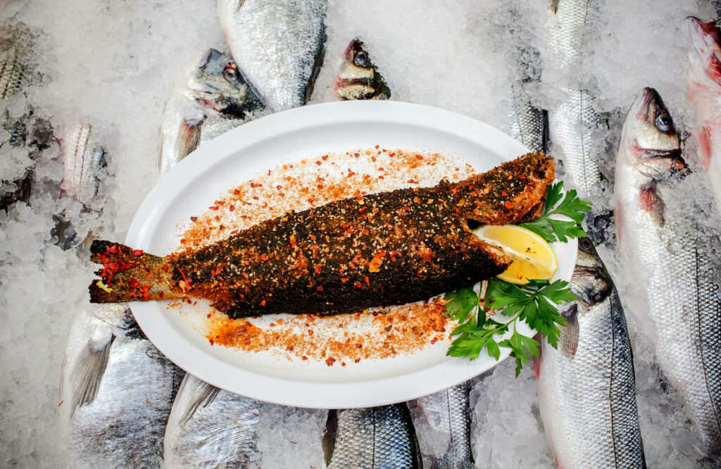 Colorful Fish Wallpaper: Seasoned Dish with Seafood & Garnishes