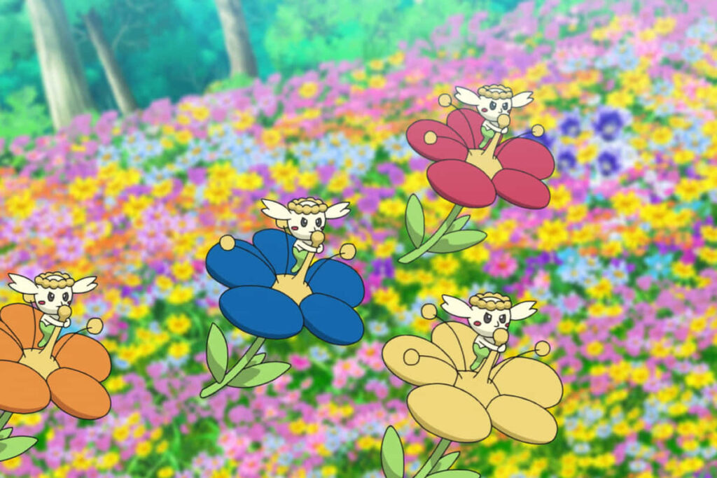 Colorful Flabébé Riding Flowers in a Vibrant Blooming Field Wallpaper