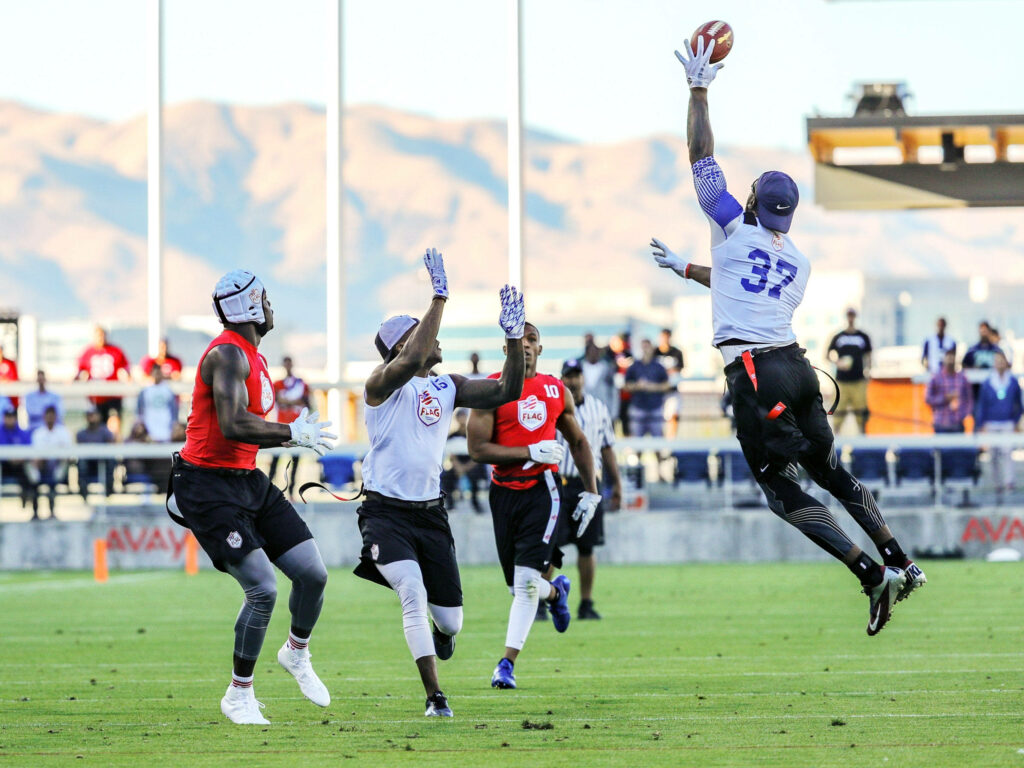 Vibrant Flag Football Action Wallpaper: Players Competing Outdoors