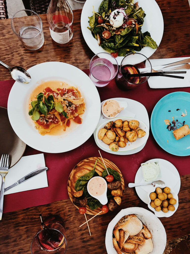 Vibrant Flat Lay of Delicious Dishes on Rustic Wooden Table Wallpaper
