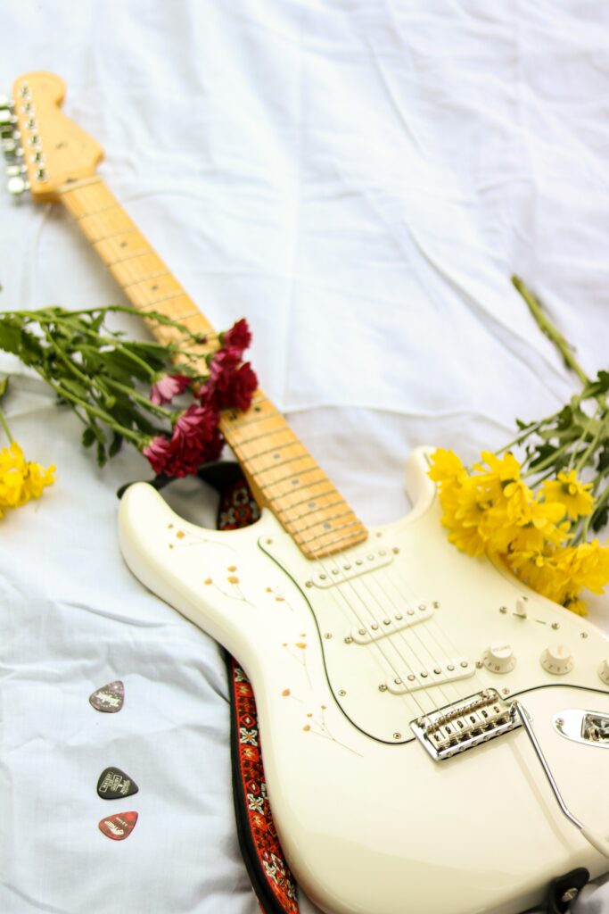 Vibrant Floral Electric Guitar Wallpaper - Musical Artistry Background