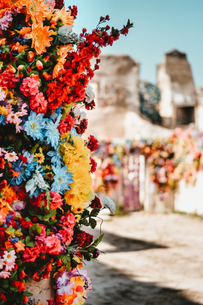 Vibrant Flower Bouquet Wallpaper with Rustic Building Background