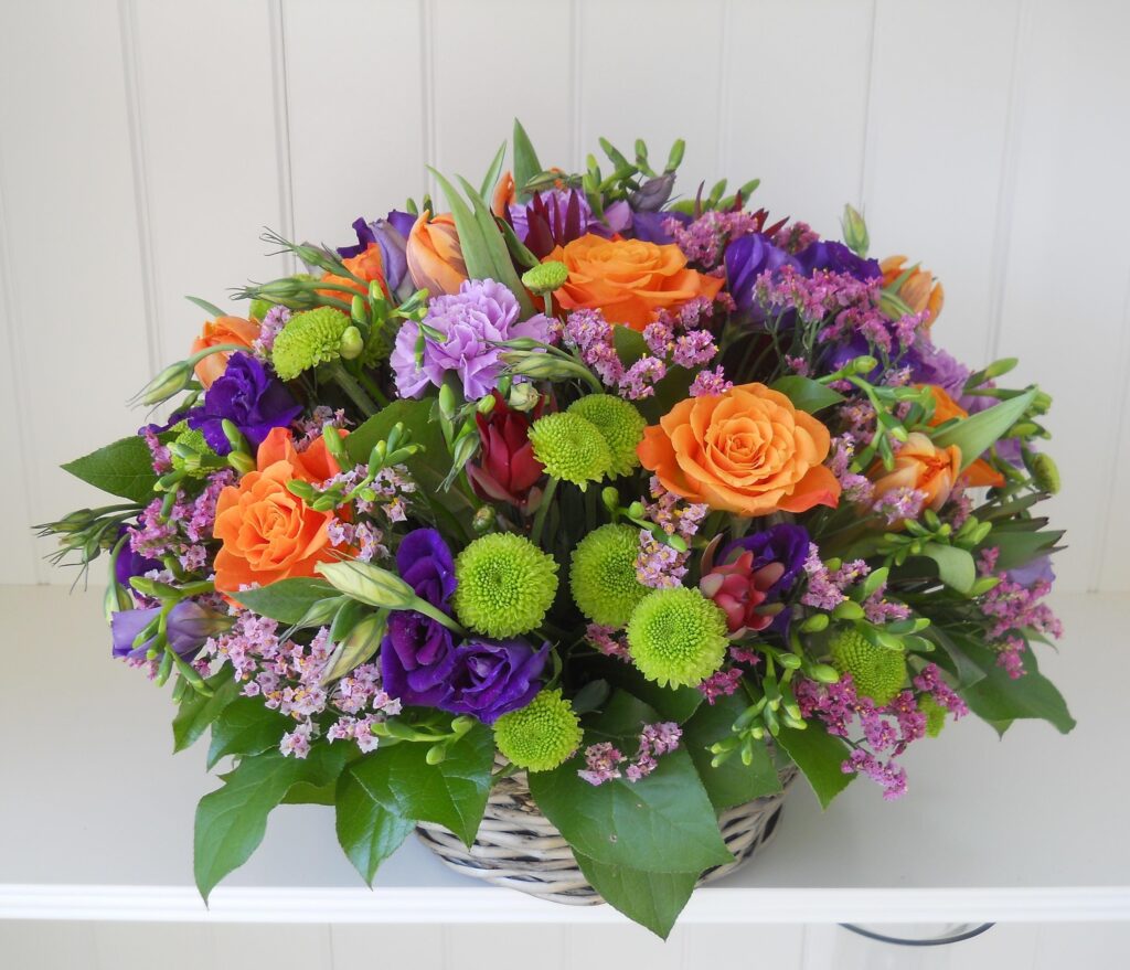 Vibrant Floral Basket Wallpaper – Colorful Roses & Greenery Background