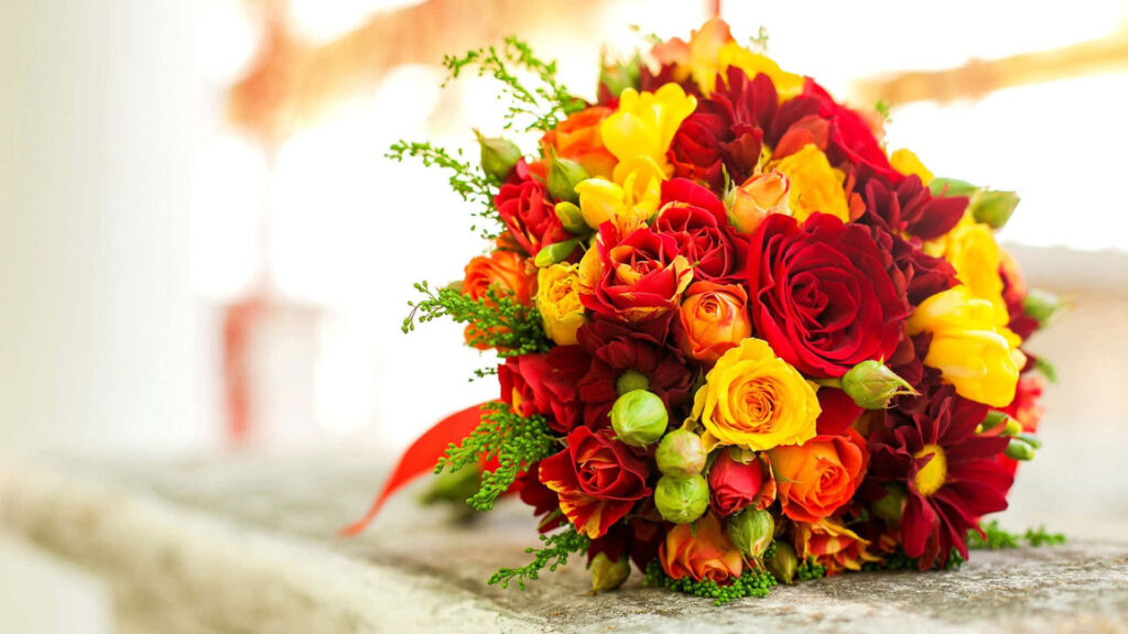 Elegant Floral Wallpaper: Vibrant Red & Yellow Roses on Soft Background