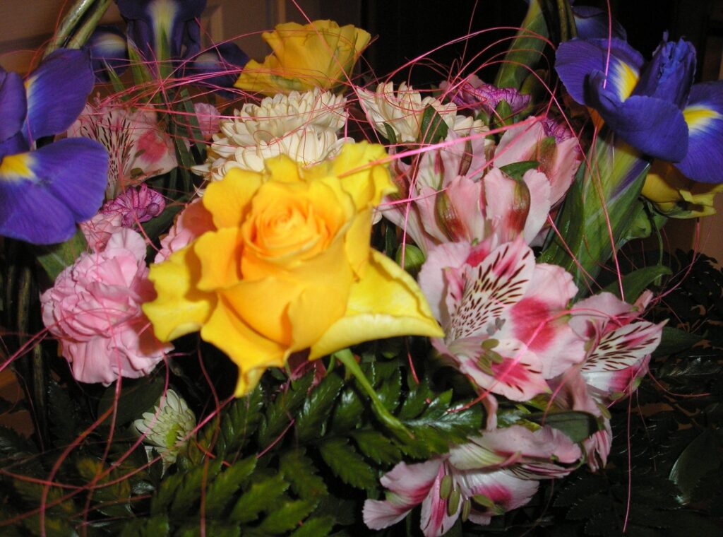Vibrant Floral Bouquet Wallpaper: Yellow Roses, Purple Irises & More