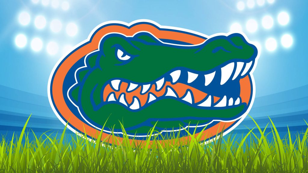 Florida Gators logo vibrant wallpaper stadium background green grass glowing floodlights football fan