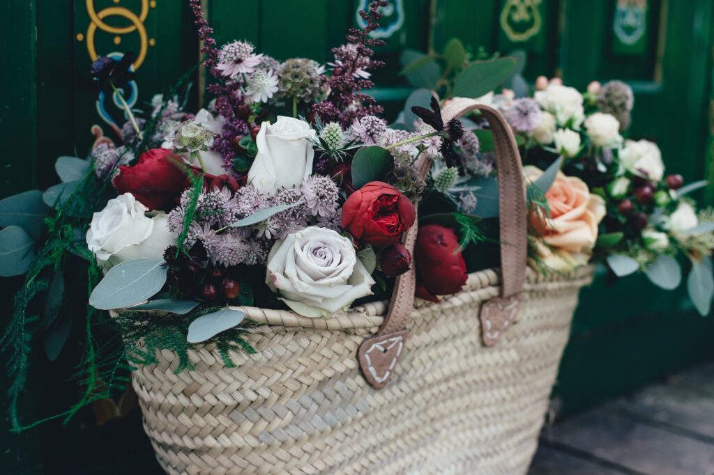 Vibrant Flower Basket Wallpaper: Red, White, and Blush Roses