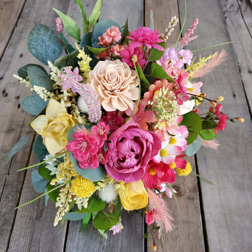 Vibrant Floral Bouquet Wallpaper on Rustic Wooden Background