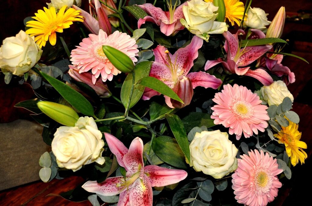 Vibrant Flower Bouquet Wallpaper: Roses, Gerberas & Lush Leaves