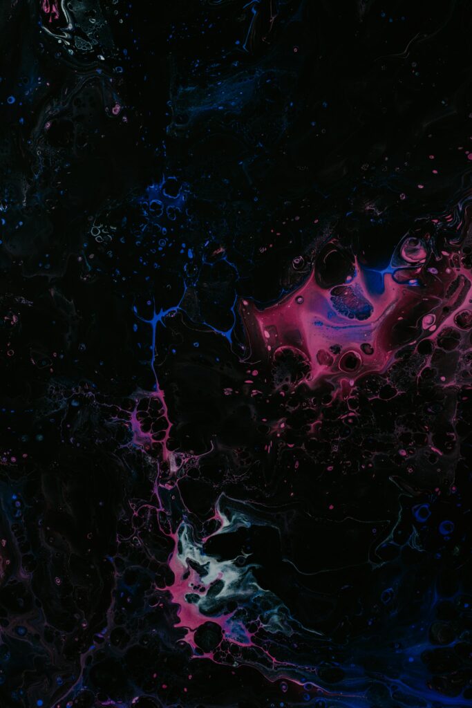 Mesmerizing Fluid Art Wallpaper: Vibrant Paint Splashes on Dark Background