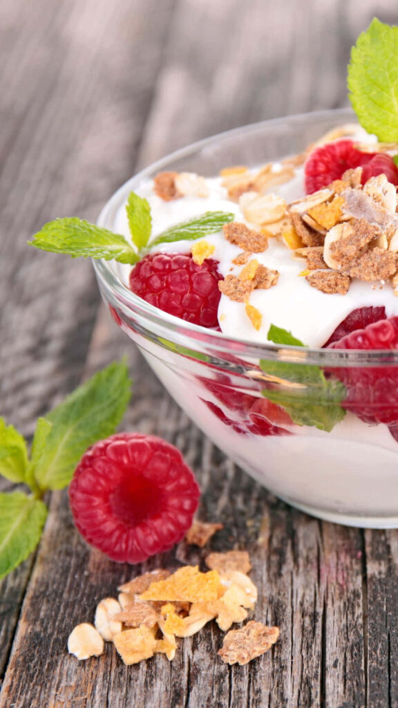 Fresh Raspberry Yogurt Bowl Wallpaper - Vibrant Food Background