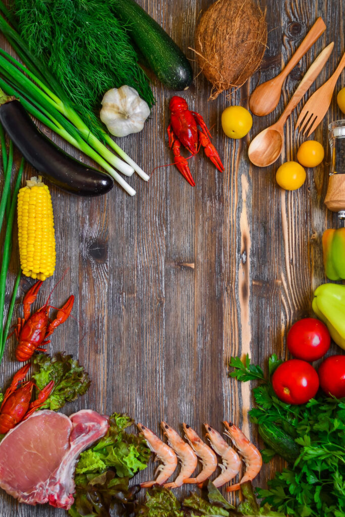 “Vibrant Food Wallpaper: Fresh Seafood, Meat & Veggies on Wood”