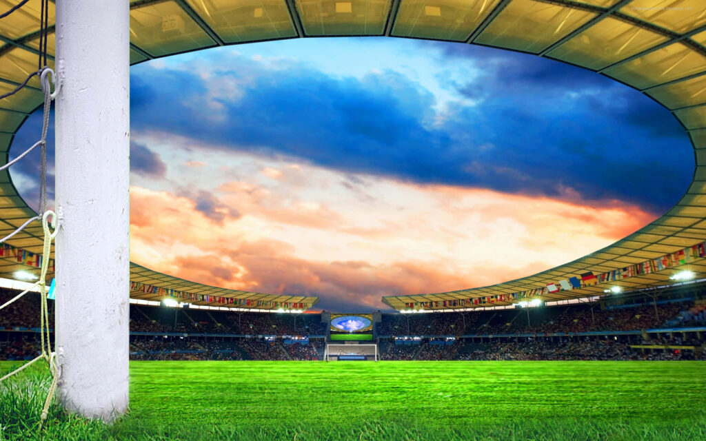 Vibrant Football Field Wallpaper: Lush Grass & Dramatic Sky