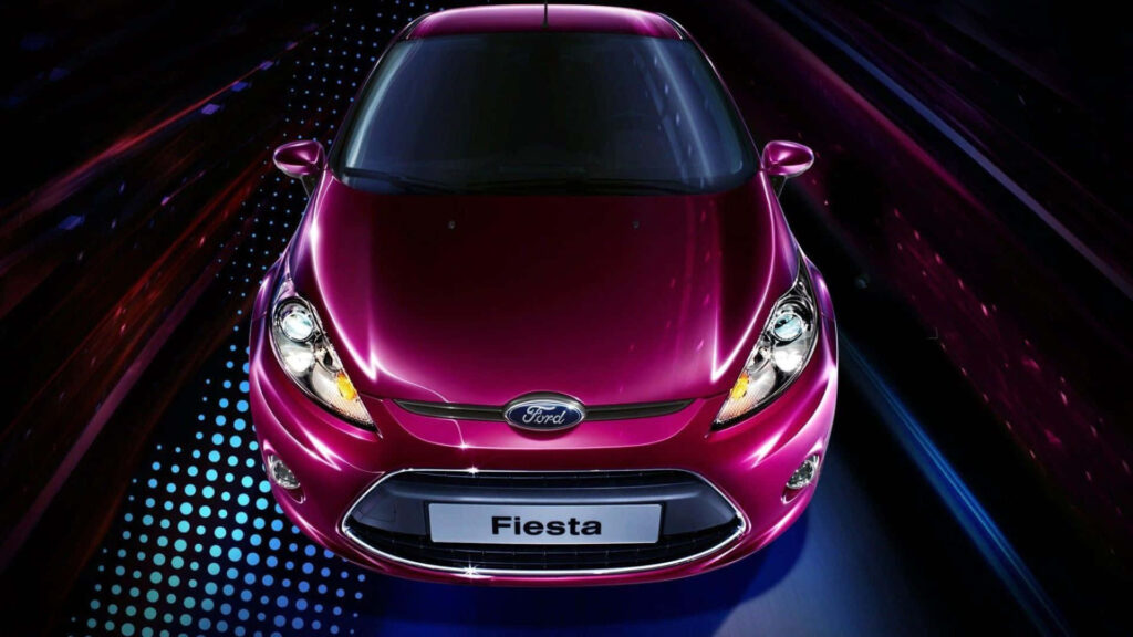 Vibrant Ford Fiesta with sleek design and bold color illuminated on dynamic modern wallpaper background
