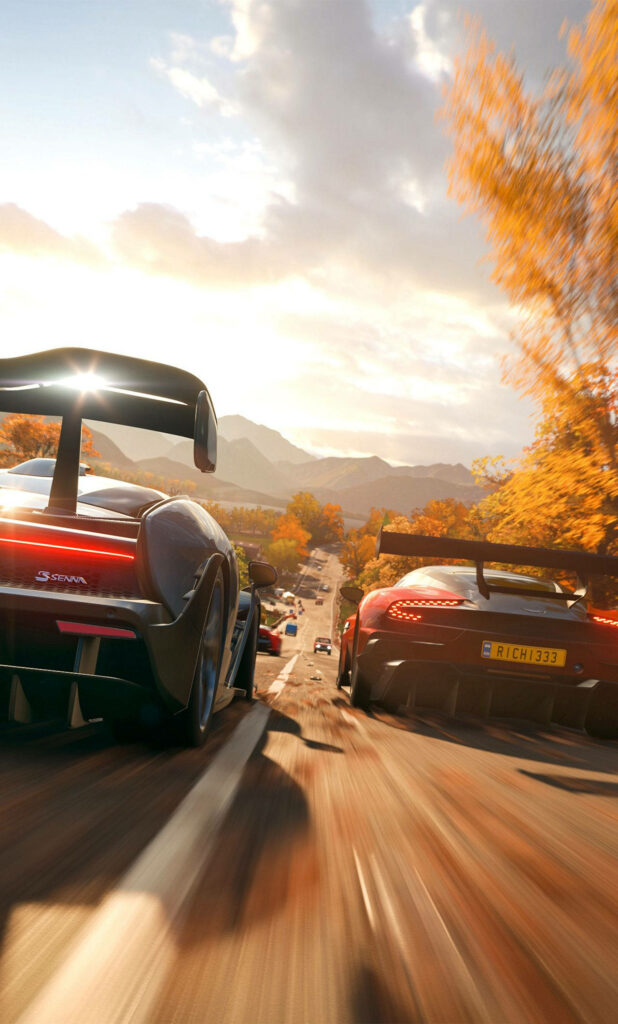 Vibrant Forza Autumn Wallpaper: High-Speed Cars Amid Fall Foliage