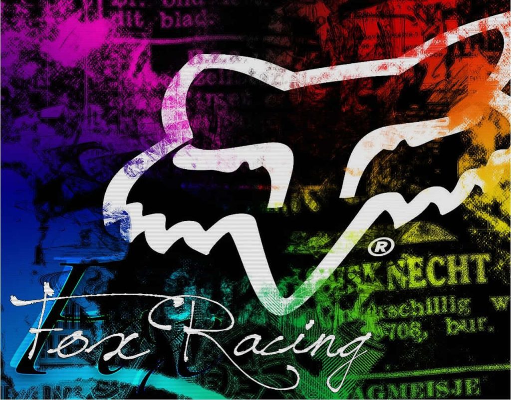 Vibrant Fox Racing wallpaper with iconic Fox Head logo on textured purple blue yellow grunge background
