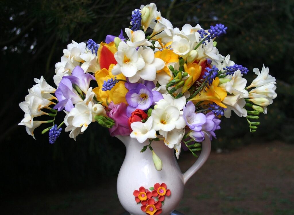 Colorful Freesia & Muscari Bouquet in Decorative Pot - Floral Background Wallpaper