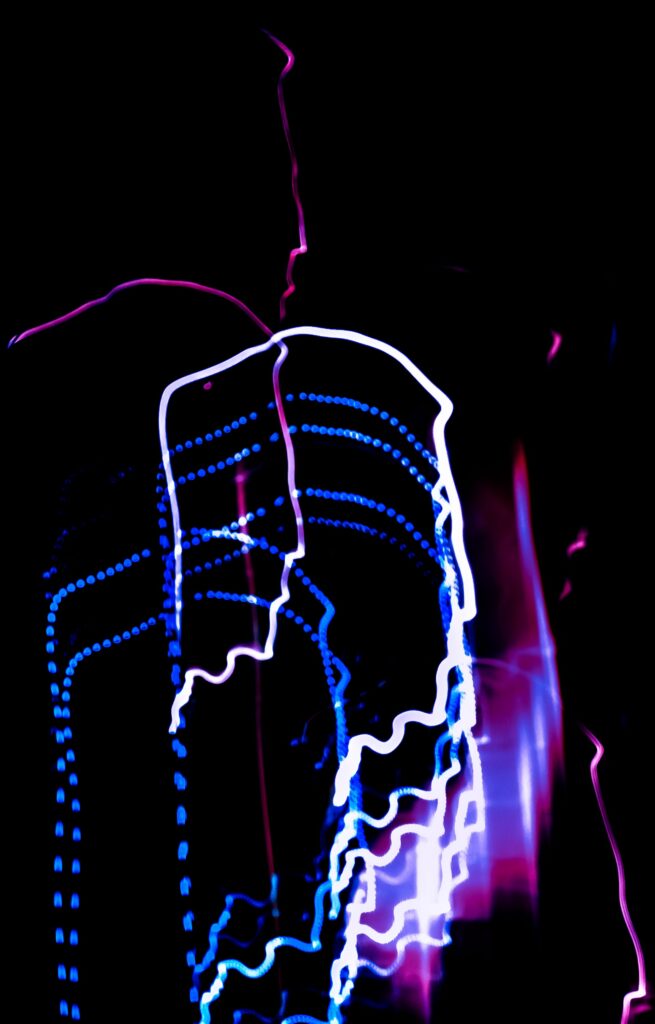 Vibrant Freezelight Abstract Wallpaper on Black Background
