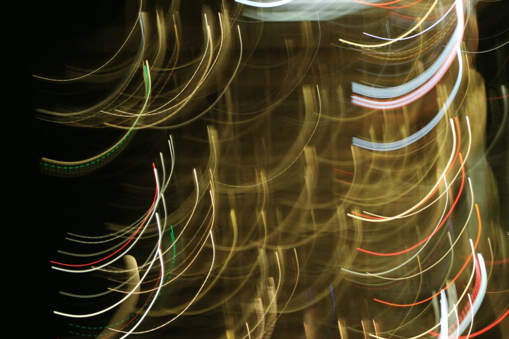 Mesmerizing Freezelight Wallpaper: Neon Circular Patterns & Arcs