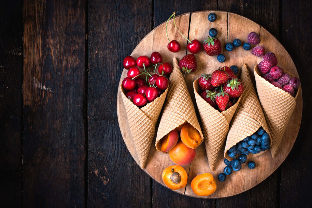 Vibrant Fresh Fruits in Waffle Cones: Healthy Cuisine Wallpaper