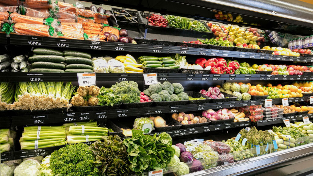 Vibrant Grocery Store Wallpaper: Fresh Fruits & Veggies Display