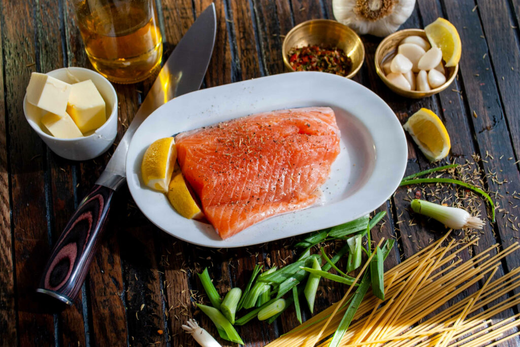 Fresh Salmon Fillet with Spices and Lemon - Vibrant Wallpaper Background