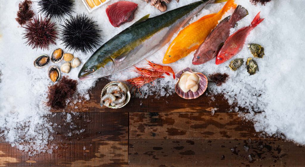 Vibrant Fresh Seafood Wallpaper: Colorful Fish & Shellfish on Ice