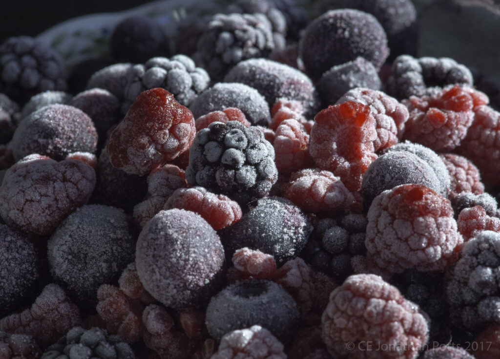 Frosty Frozen Berries Close-Up: Raspberries, Blackberries & Blueberries Wallpaper