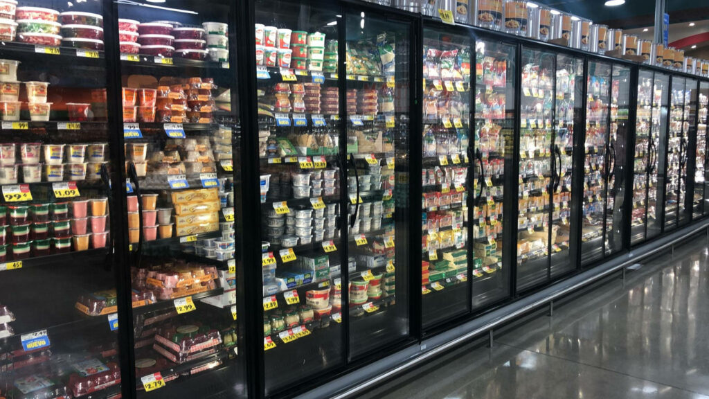 Vibrant Frozen Goods Wallpaper: Neat Supermarket Freezer Display