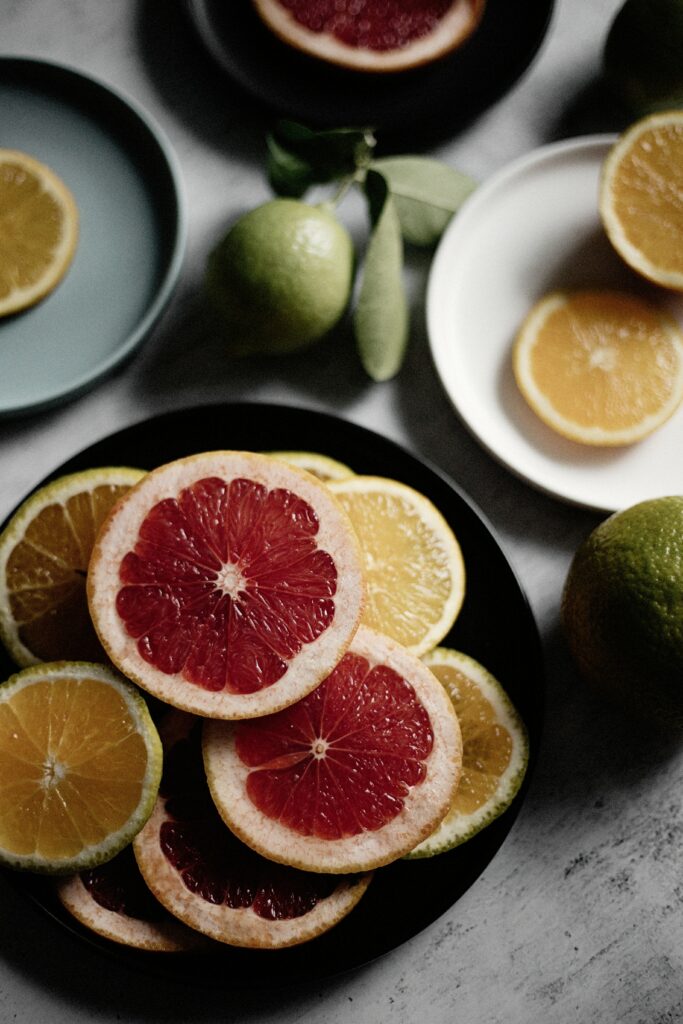 Vibrant Fruit Slice Arrangement: Grapefruit, Orange & Lemon Wallpaper