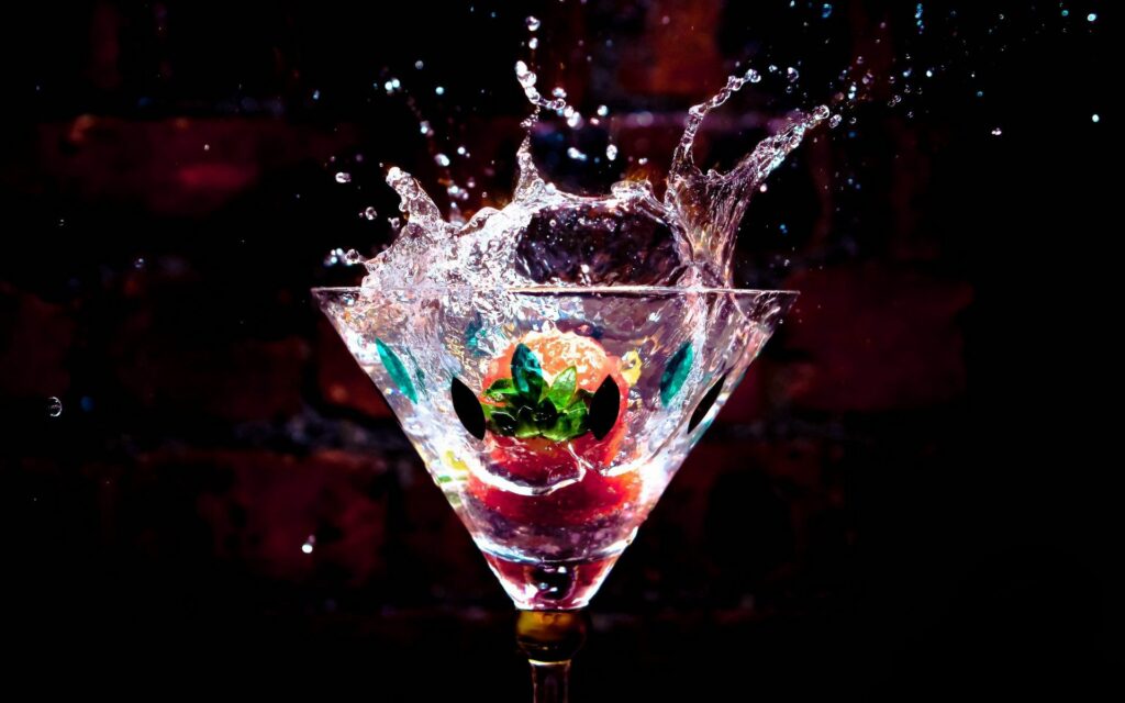 Vibrant Fruit Splash in Water: Dynamic Colorful Wallpaper Background