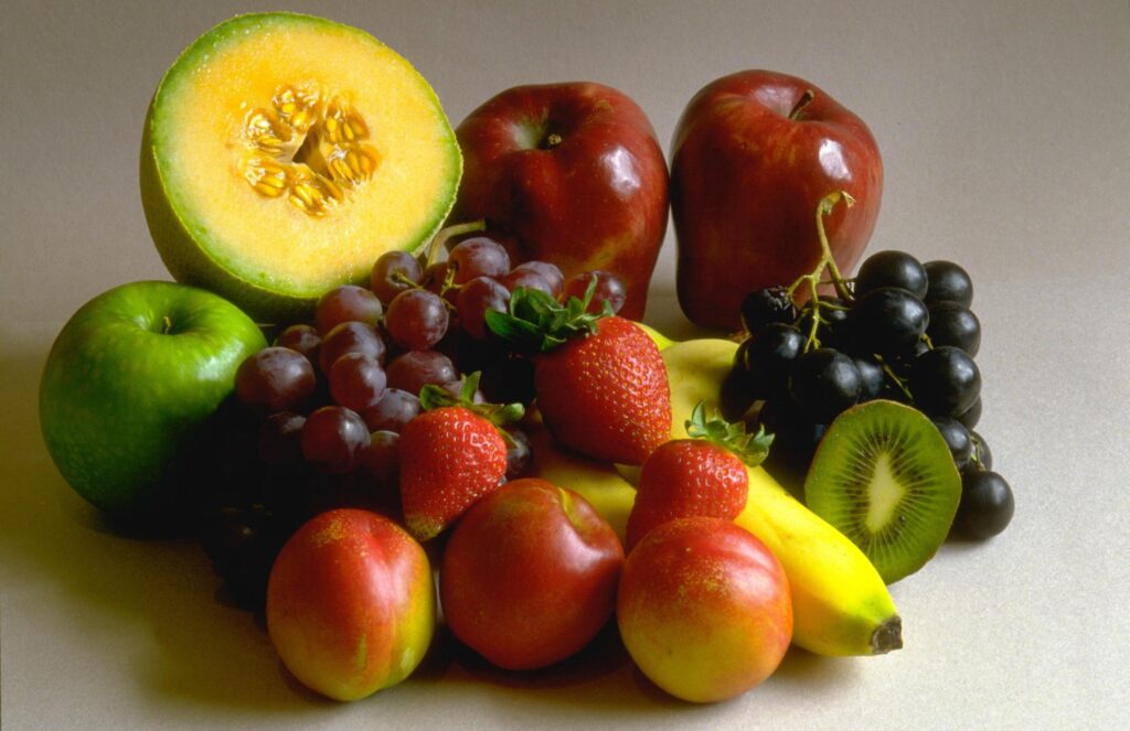 Vibrant Fruit Wallpaper: Colorful Assortment of Fresh Fruits Background