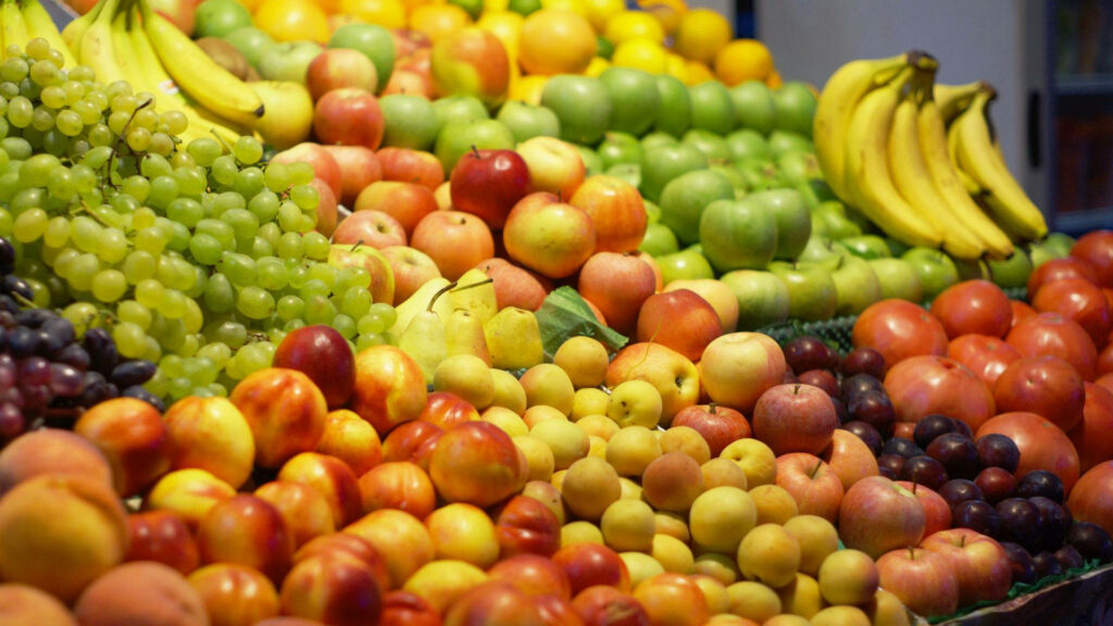 Vibrant Fruit Wallpaper: Fresh Bananas, Grapes, Apples & Peaches