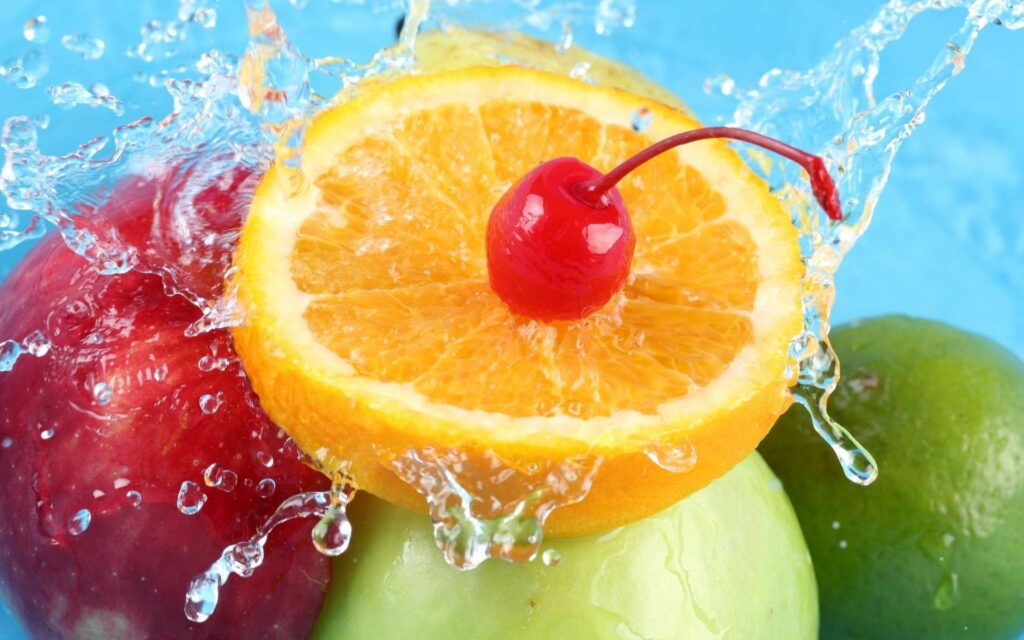 Vibrant Fruit Wallpaper: Fresh Oranges, Apples & Cherries Splash