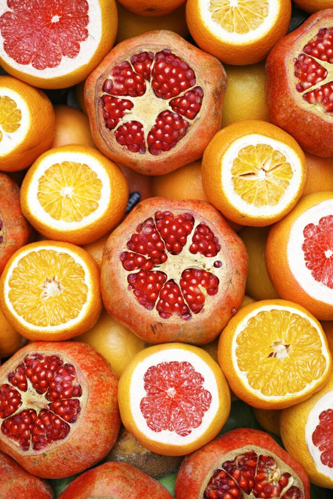 Vibrant Fresh Fruit Wallpaper: Pomegranates, Oranges & Grapefruits