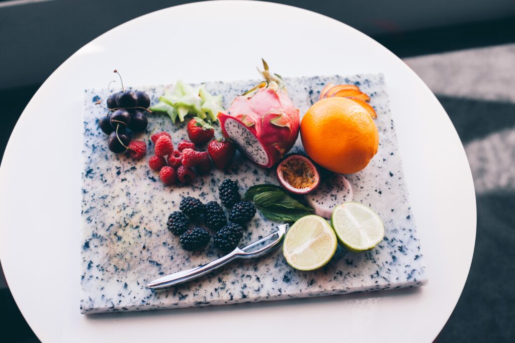 Exotic Fruit and Berry Display: Colorful Wallpaper Background
