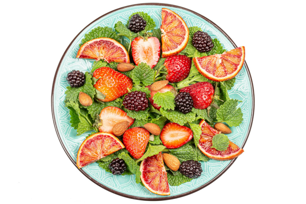 Vibrant Fruit and Berry Wallpaper on Turquoise Plate - Fresh Design