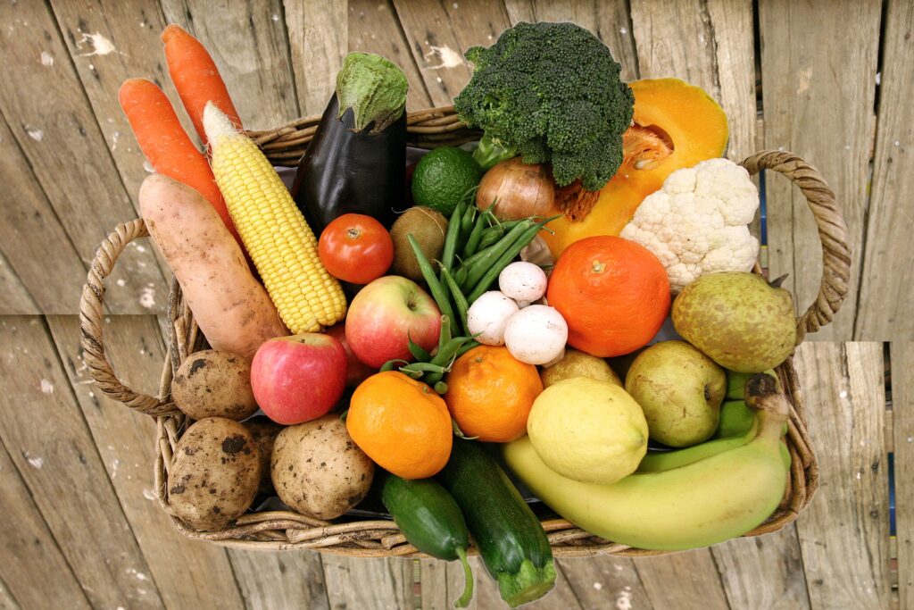 Vibrant Fruits & Veggies Wallpaper: Rustic Basket Background