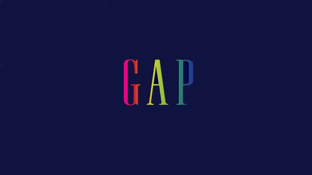 Gap logo wallpaper with smooth vertical rainbow gradient on dark navy blue background