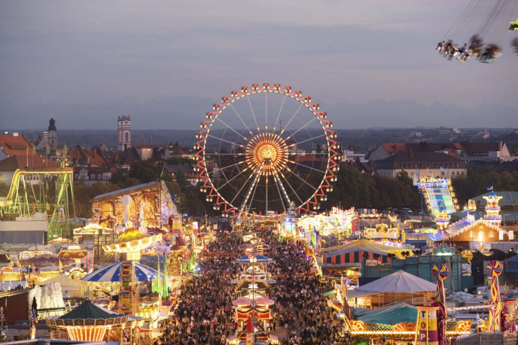 Vibrant Germany Festival Wallpaper: Colorful Lights & Ferris Wheel