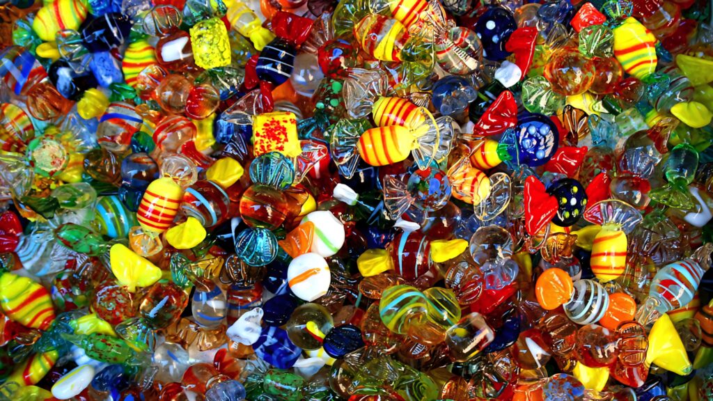 Colorful glass candies with intricate patterns glossy textures vibrant cheerful Full HD wallpaper background